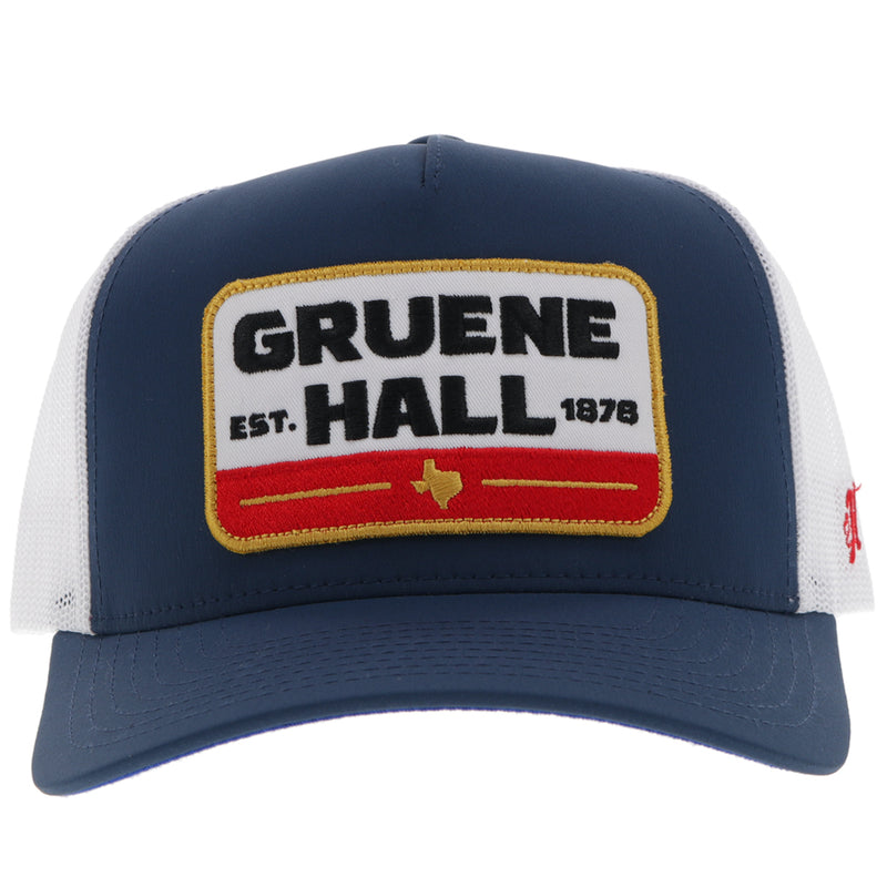 front of navy and white Gruene Hall x Hooey hat with white, red, gold, black logo patch