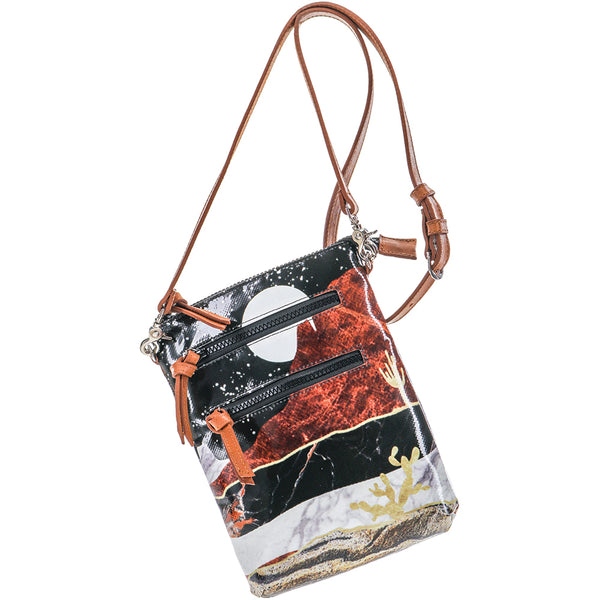 Desert Nights crossbody bag with two zipping compartments and tassels on each zipper also featuring a leather strap