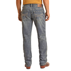 back of the Light Wash Relaxed Fit Stackable Bootcut Hooey jeans on male model wearing a yellow tee and brown cowboy boots