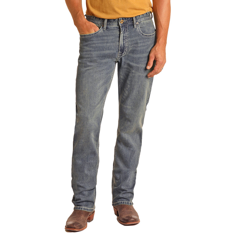 front of the Light Wash Relaxed Fit Stackable Bootcut Hooey jeans on male model wearing a yellow tee and brown cowboy boots