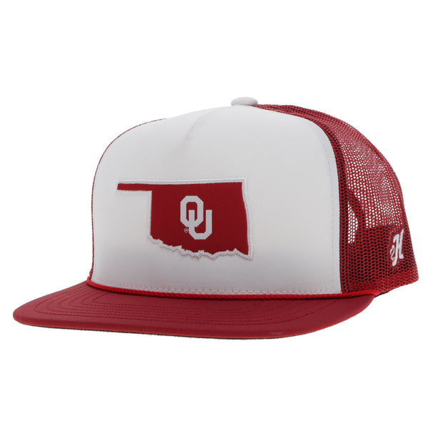 Red and white OU hat with red bill and mesh ad white front panel featuring red Oklahoma shaped patch with OU logo in white in the center and white H logo on the side of the hat