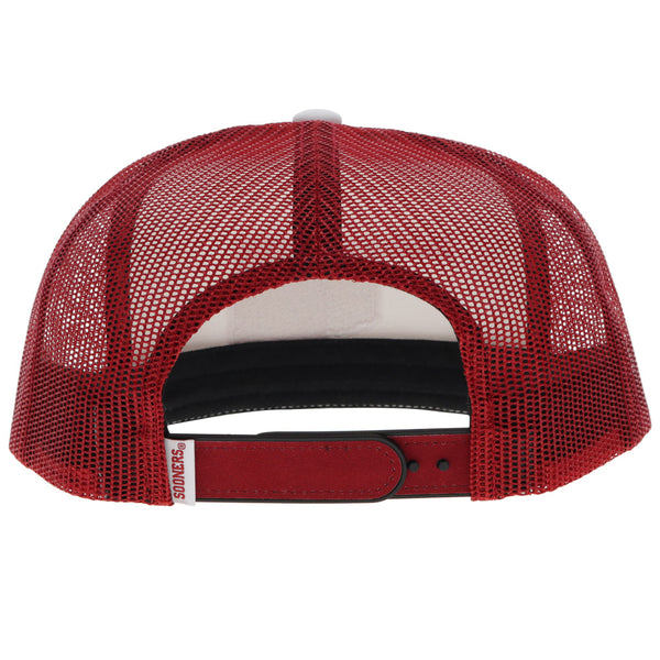 back of red and white OU hat with red mesh and snap bands and red and white sooners tag