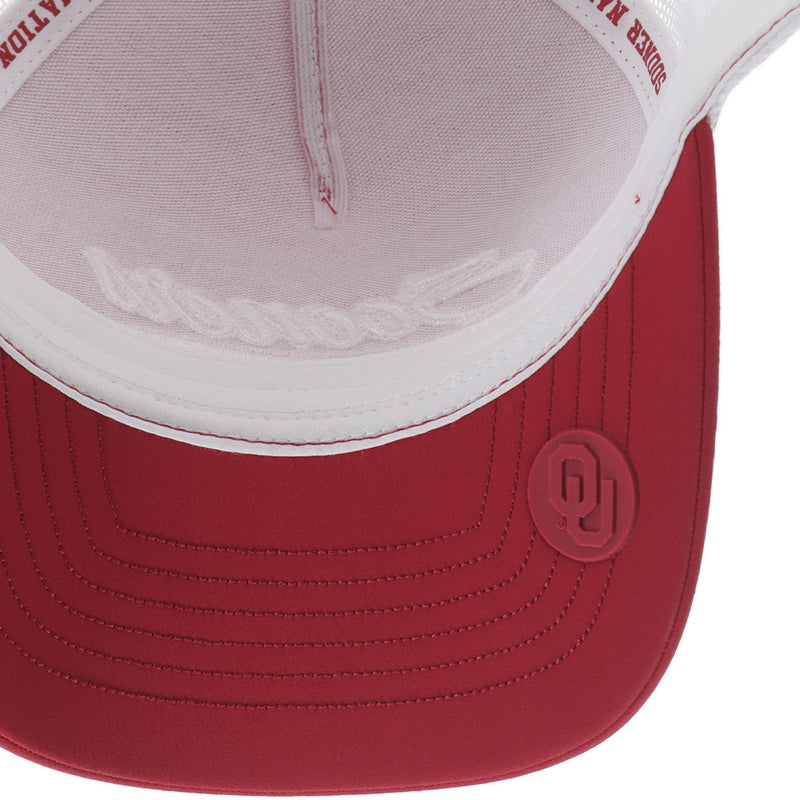 the underside of the red and white sooners x Hooey hat with the OU logo stamp