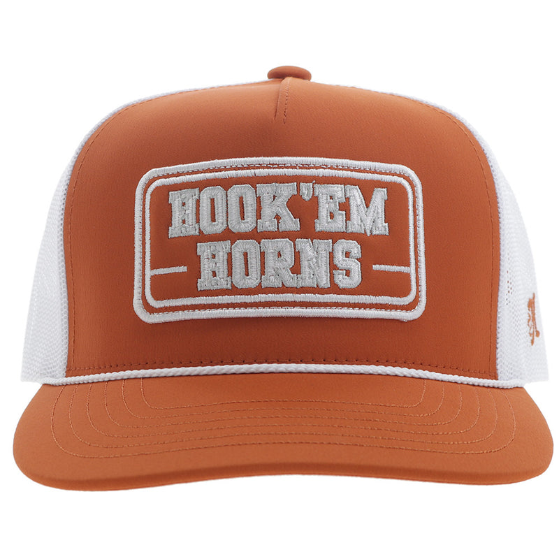 front of orange and white hat with Hook 'em Horns embroidered patch