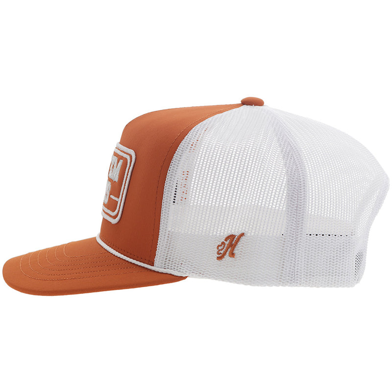 left side of orange and white hat with H logo
