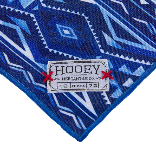 close up of the logo patch on the Ombre Aztec bandana