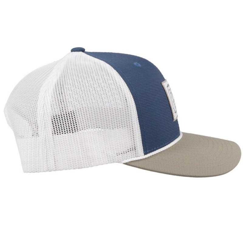 right side of the blue, white, and tan snapback hat with white patch and rope