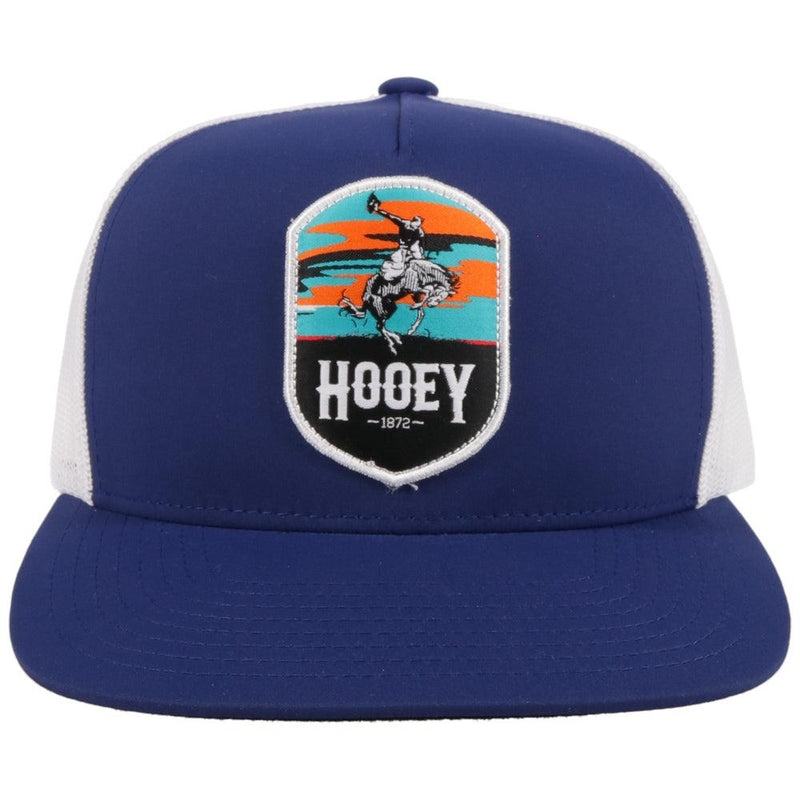 front of the Cheyenne navy and white hat with orange and teal patch