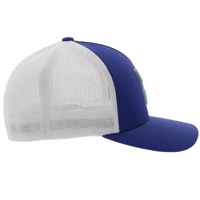 right side of the blue and white flexfit Coach hat with gold and baby blue logo
