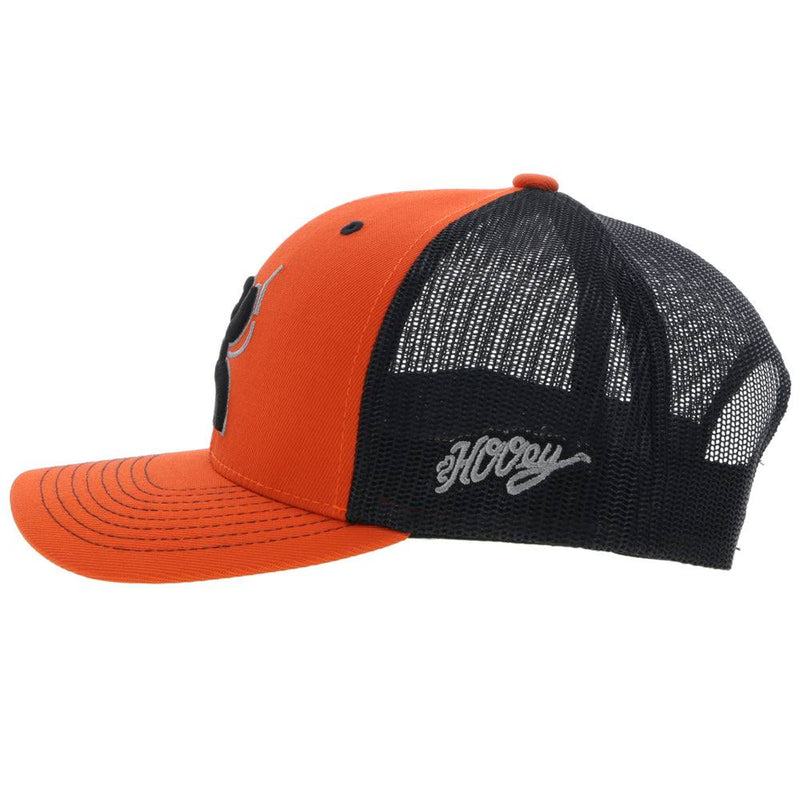 left side of the Arc orange and black hat with black and grey Arc logo