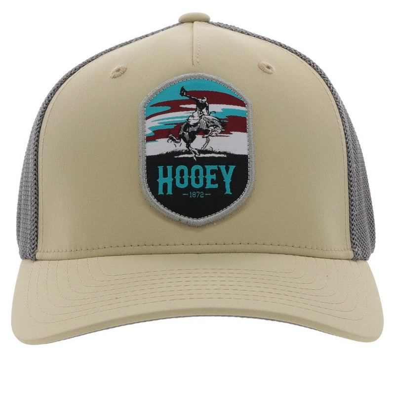 front of the youth tan and grey flexfit Cheyenne hat
