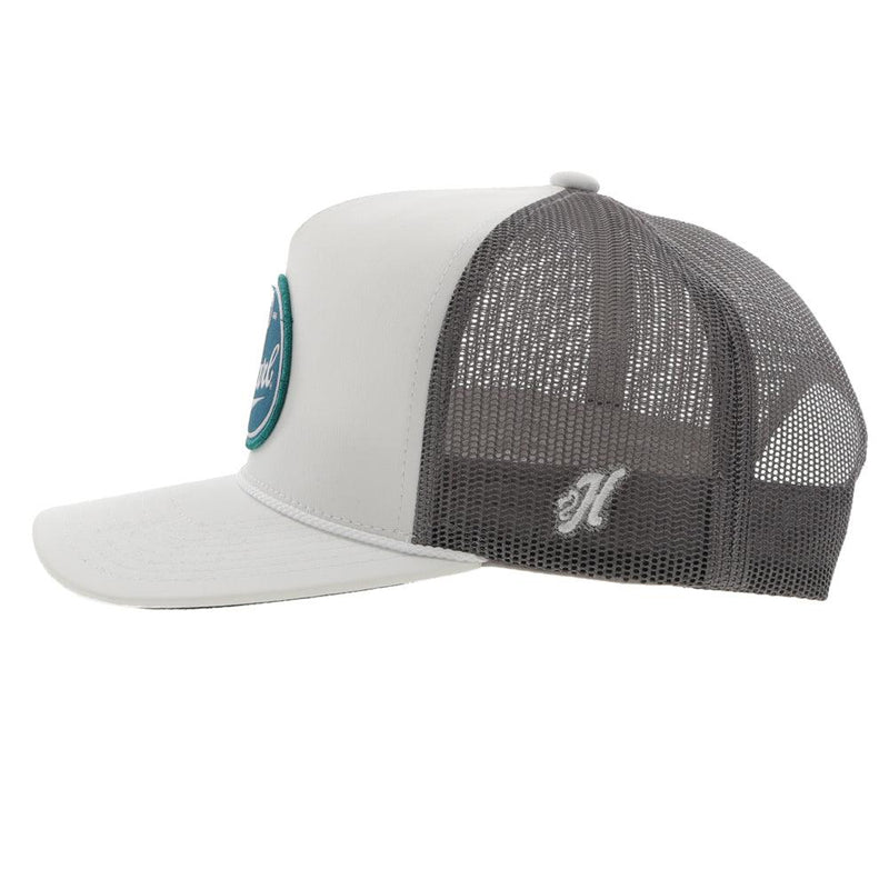 left side of the Pearl white and grey hat with turquoise, blue, and white patch