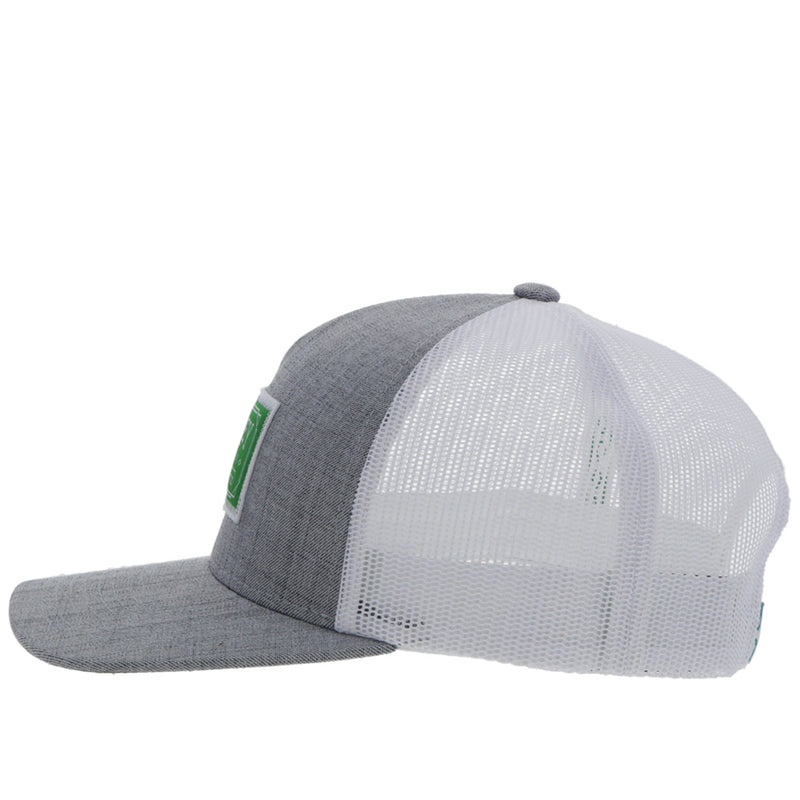 left side of the Doc grey and white hat with green and white patch
