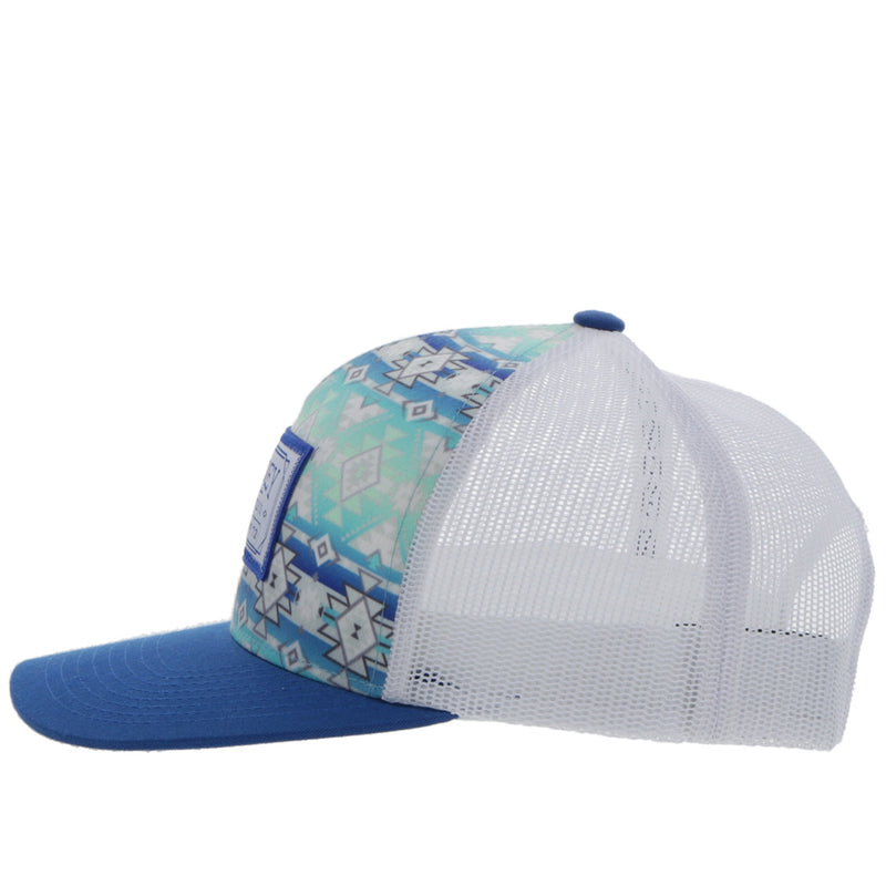 left side view of the Doc blue and white hat with teal, blue, and white Aztec patter on the front