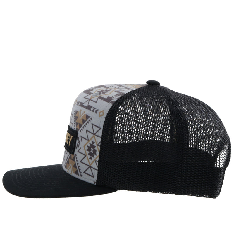 left side of the Youth Lock-up grey and black hat with tan and brown Aztec pattern and gold/black patch