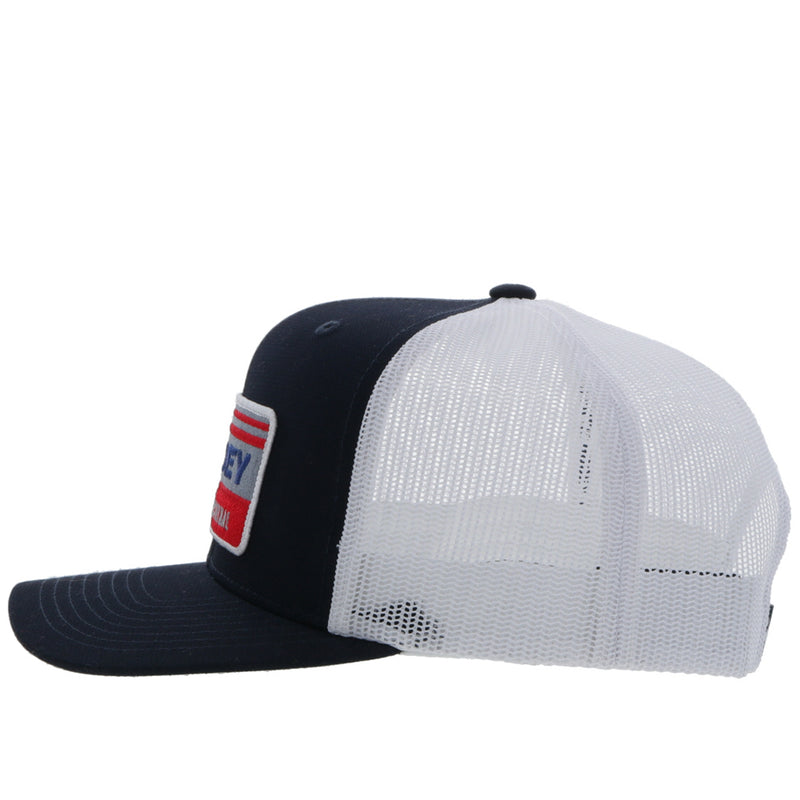 left side of the Youth Horizon navy and white hat with blue, red, and grey patch