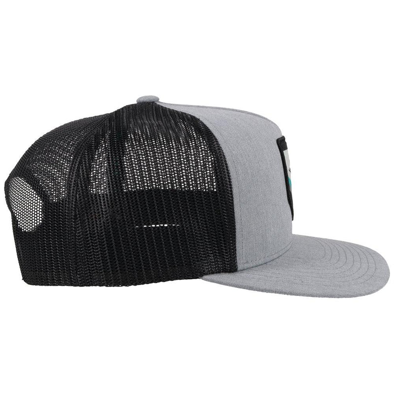 rigth side view of the grey and black youth hat with teal, white, black patch