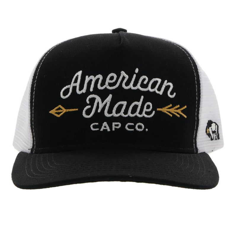 front view of the Black and white AMCC Hooey hat with gold arrow detail
