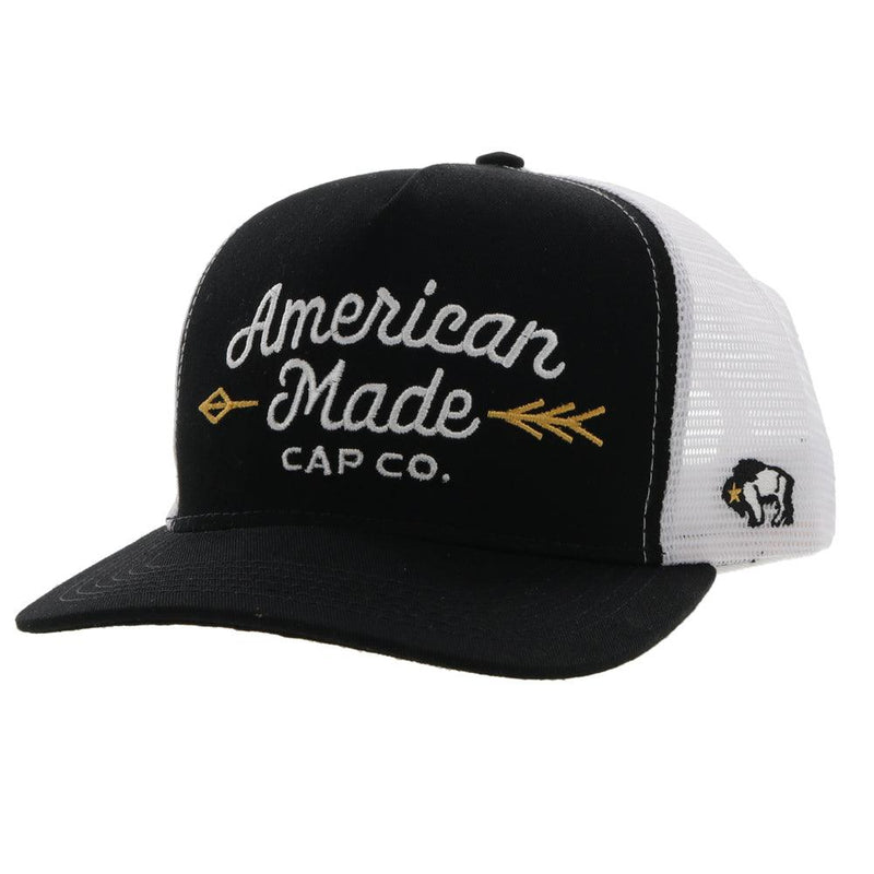 Black and white AMCC Hooey hat with gold arrow detail