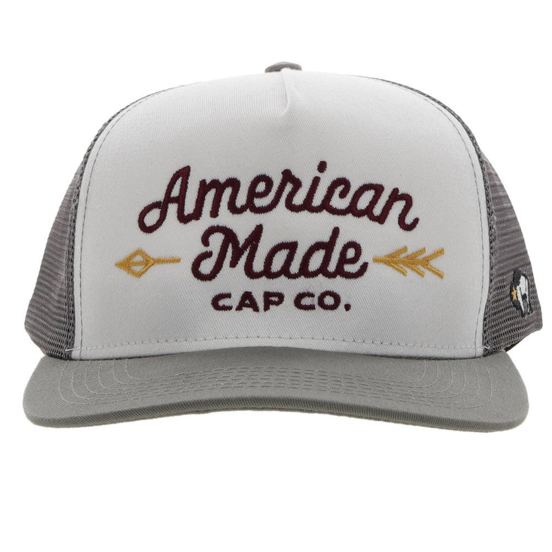 front view of the AMCC white and grey hat with maroon and gold stitching