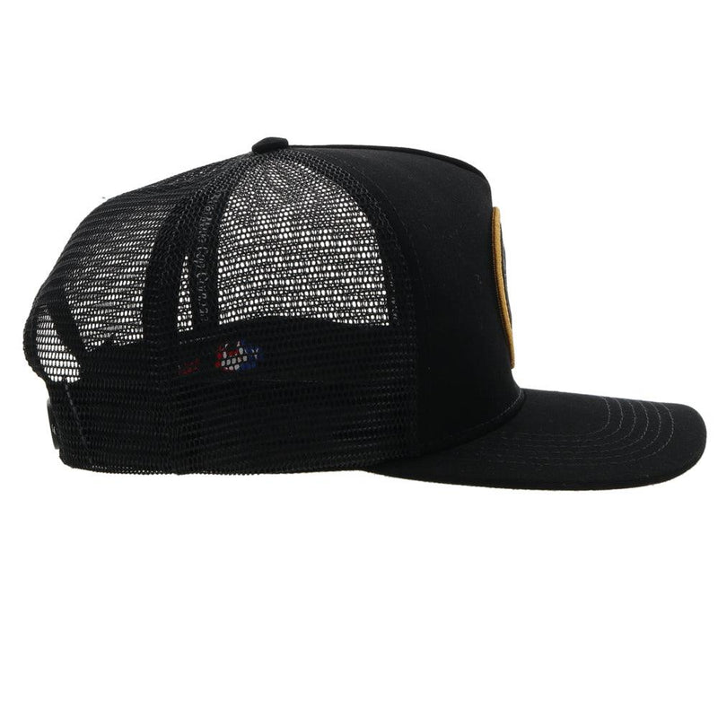 right side view of the black AMCC hooey hat with gold and grey logo