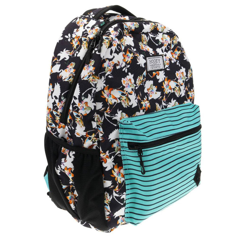 side view of the Recess black and white floral pattern backpack