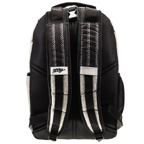 back of the Ox grey backpack featuring a black back pad with grey and black arm straps