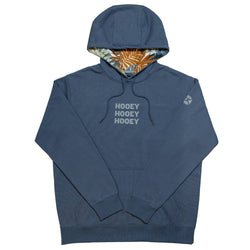 Tres blue hoody with grey logo and multi colored leaf pattern in hood lining