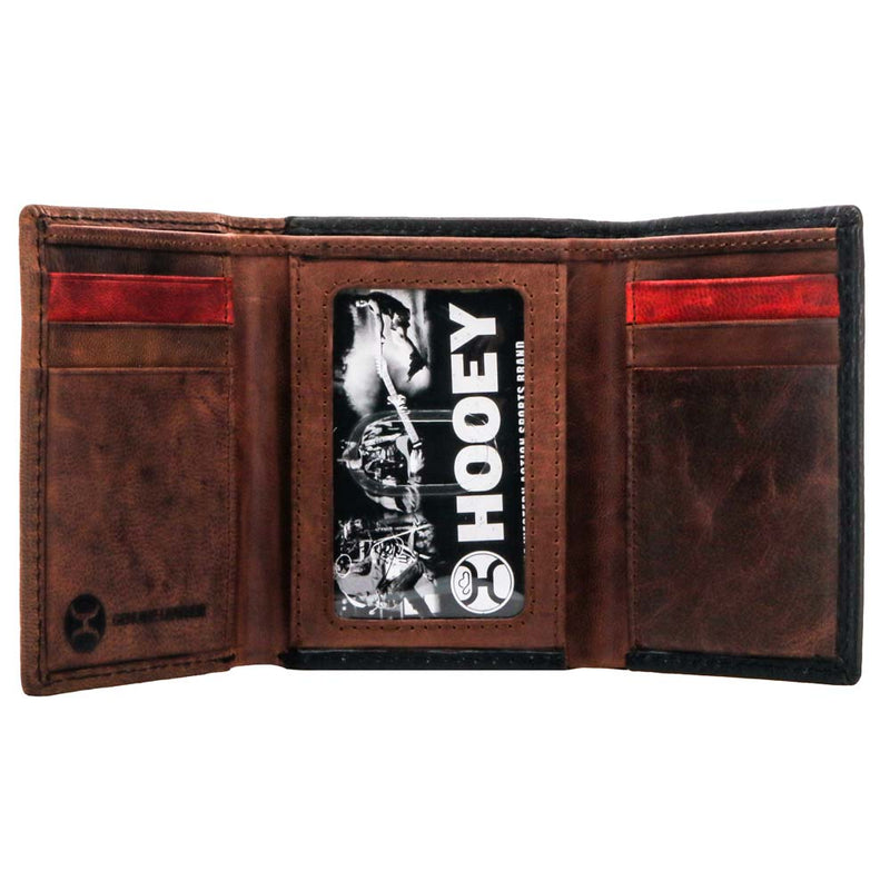inside of the Chapawee trifold wallet in brown leather with ivory, red, black laser but Aztec patter with red details