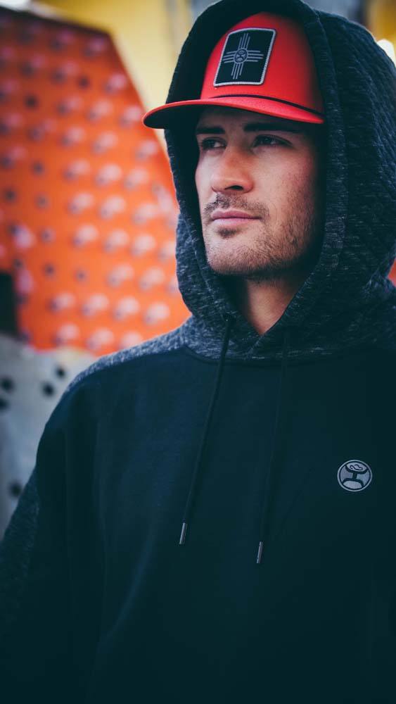 close up image of model wearing the canyon black and grey hoody