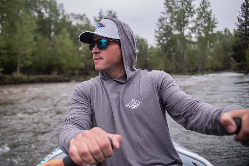 Hooded Captain long sleeve t-shirt in grey on a male model canoeing down a river