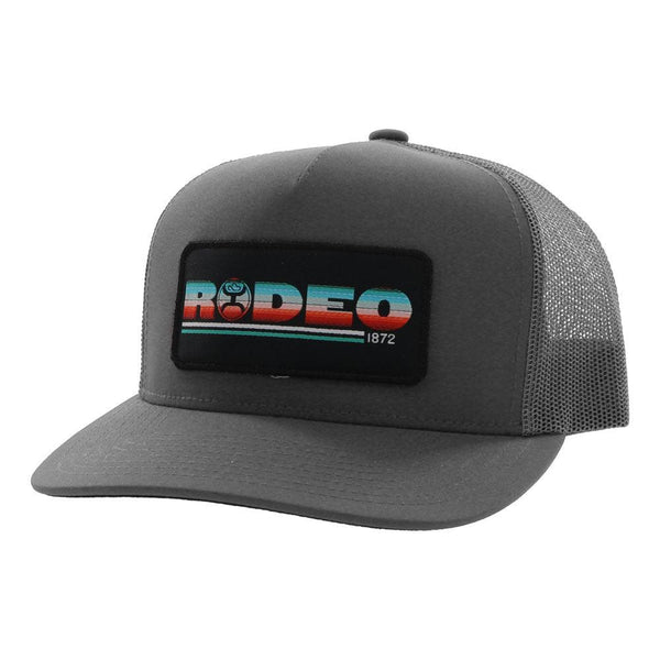 grey rodeo hat with black patch and multi colored RODEO on patch