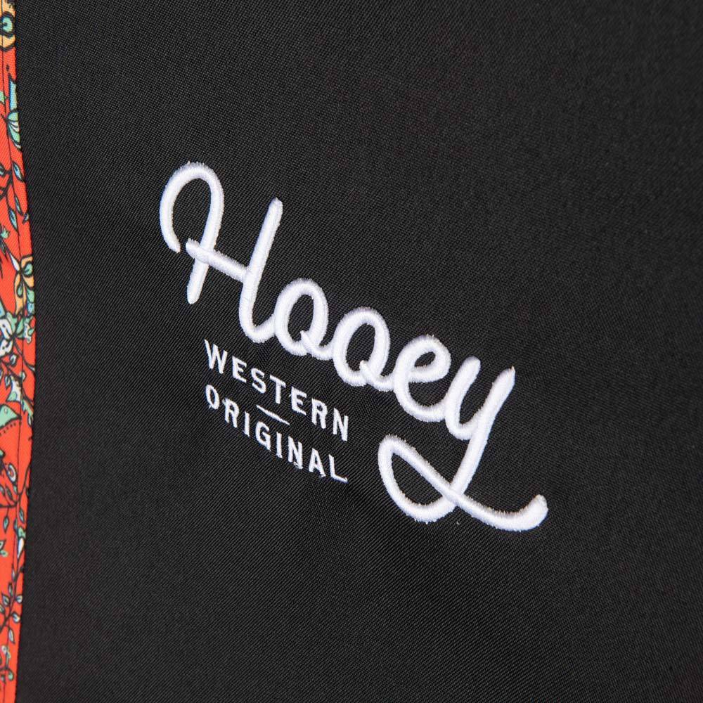 close up of the logo on the western floral red hooey seat cover