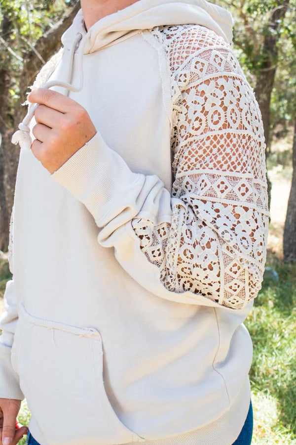 side image of model wearing Chaparral hoody in tan with crochet mesh